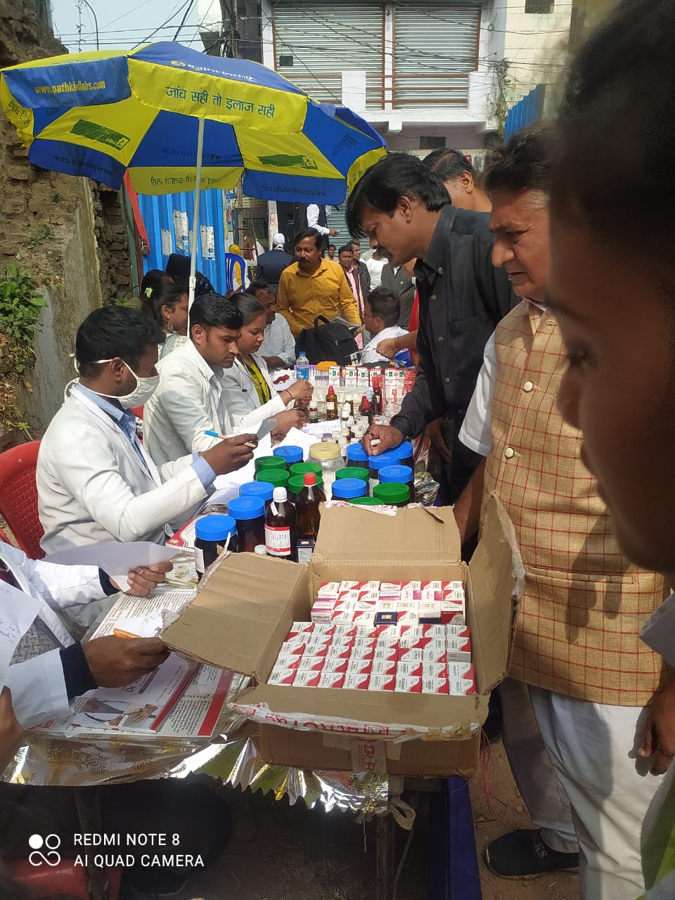 Check up of patients being done by students from Mahatma Gandhi Homoeopathic Medical College in a medical camp.