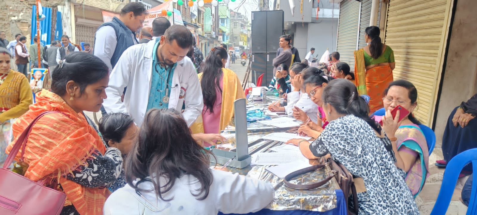 Check up of patients being done by students from Mahatma Gandhi Homoeopathic Medical College in a medical camp.