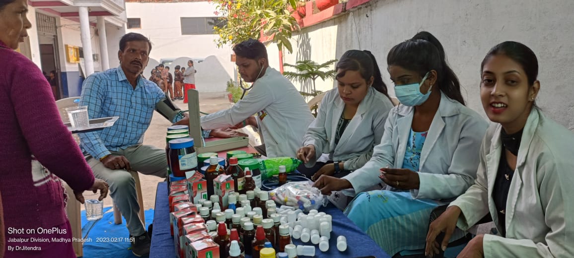 Check up of patients being done by students from Mahatma Gandhi Homoeopathic Medical College in a medical camp.