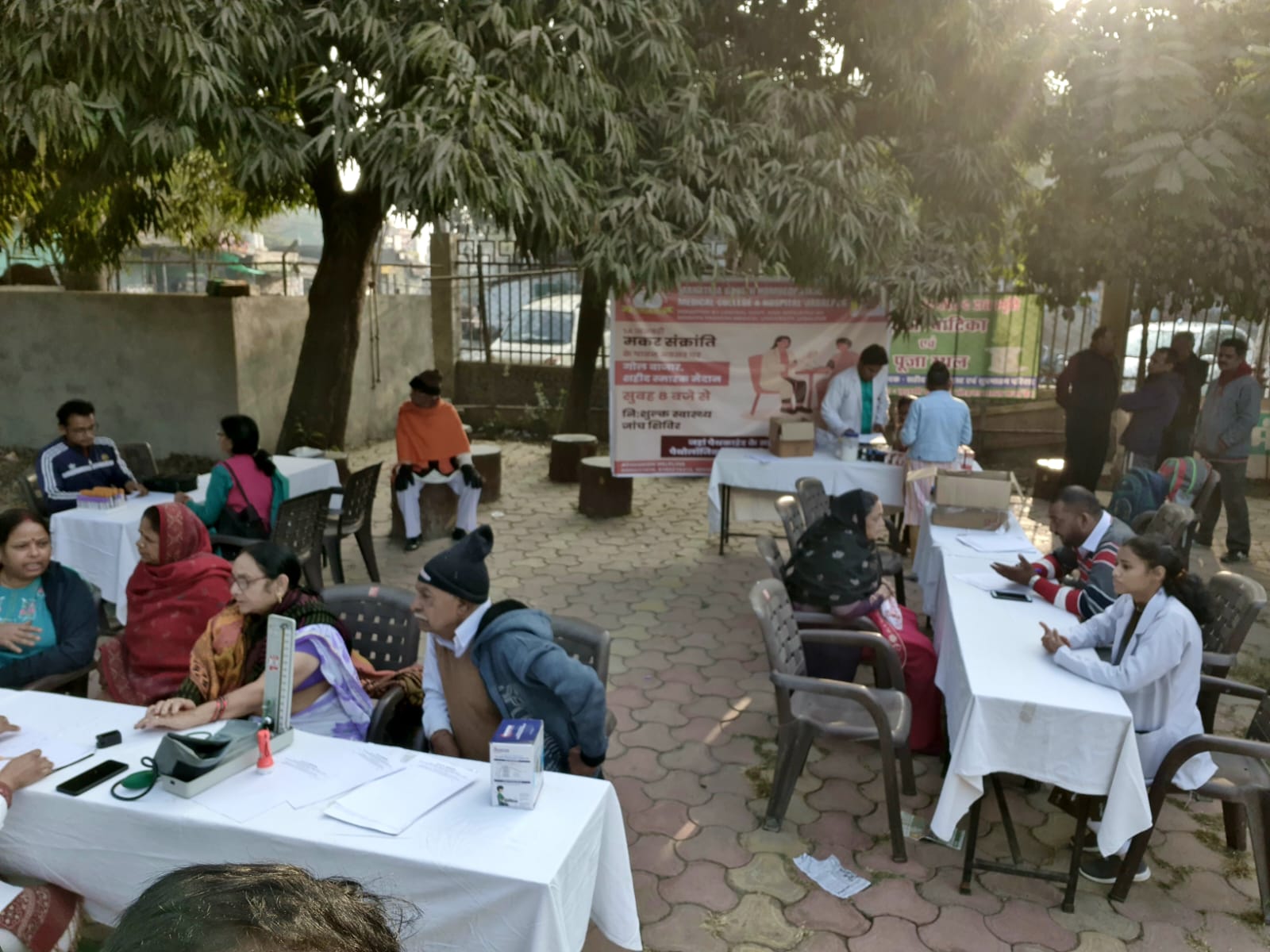 Check up of patients being done by students from Mahatma Gandhi Homoeopathic Medical College in a medical camp.