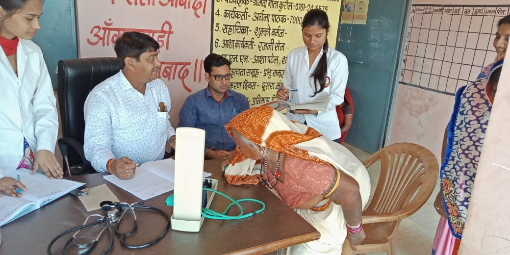 Check up of patients being done by students from Mahatma Gandhi Homoeopathic Medical College in a medical camp.