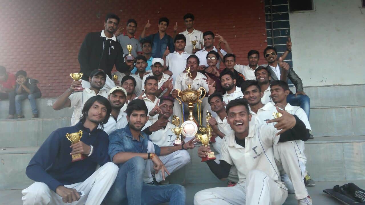 Photograph of a team after winning their trophy.