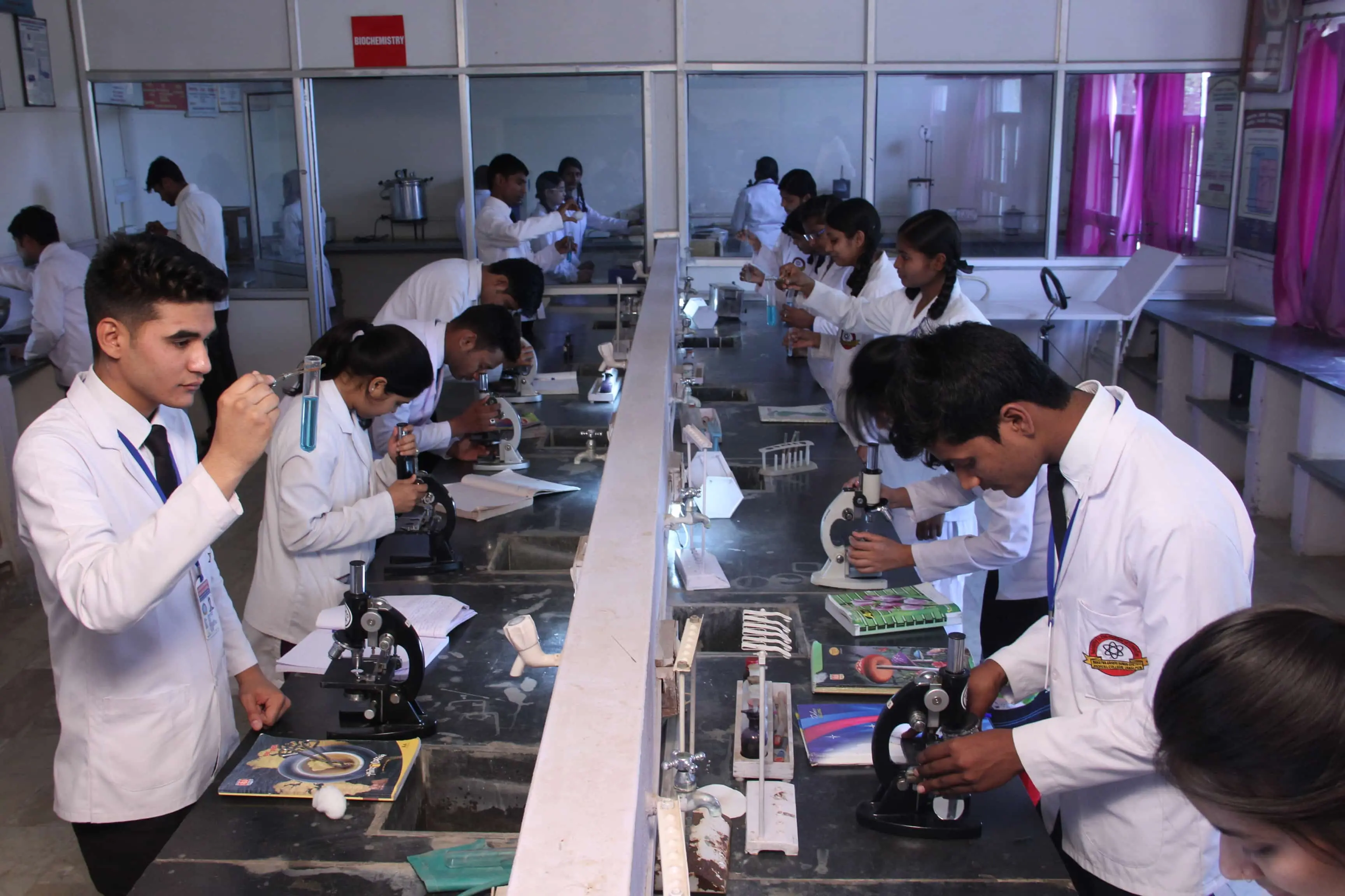 Students experimenting in a lab.